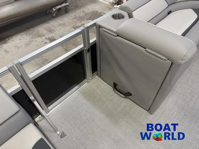 Slide: The Image of 2025 Tahoe Sport 2185 Rear Fish boat interior with gray seating and cup holder. - 24