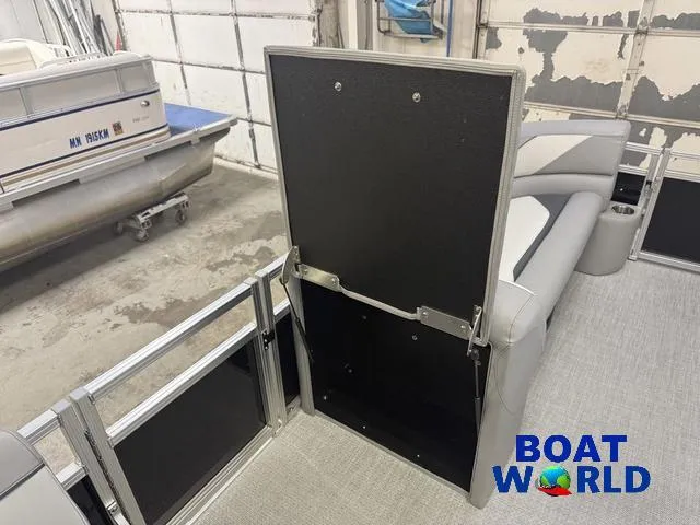 Slide: The Image of 2025 Tahoe Sport 2185 Rear Fish boat interior in a garage setting. - 25