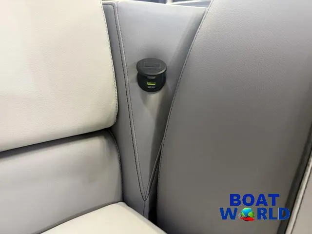 Slide: The Image of 2025 Tahoe Sport 2185 boat interior with sleek gray seating and USB port. - 28