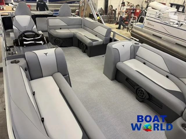 Slide: The Image of 2025 Tahoe Sport 2185 Rear Fish boat interior with gray seating and steering wheel. - 30