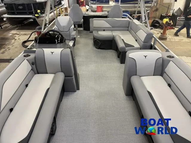 Slide: The Image of 2025 Tahoe Sport 2185 Rear Fish boat interior with gray seating and steering console. - 7
