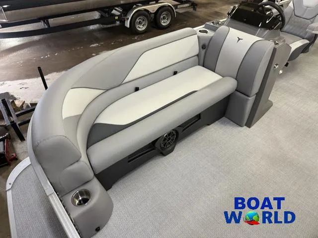 Slide: The Image of 2025 Tahoe Sport 2185 Rear Fish boat interior with gray seating and cup holders. - 8