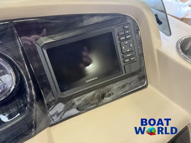 Slide: The Image of Garmin display on 2025 Tahoe LTZ 2385 Elite Cruise boat dashboard. - 16