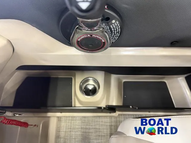 Slide: The Image of 2025 Tahoe LTZ 2385 Elite Cruise boat interior with Honda 4-Stroke EFI controls. - 17