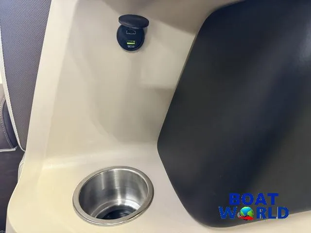 Slide: The Image of 2025 Tahoe LTZ 2385 Elite Cruise interior with cup holder and USB port. - 28