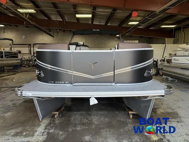 Slide: The Image of 2025 Tahoe LTZ 2385 Elite Cruise pontoon boat in a showroom. - 32