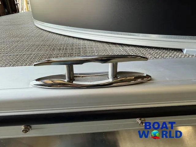 Slide: The Image of 2025 Tahoe LTZ 2385 Elite Cruise boat cleat, close-up view, Boat World logo visible. - 34