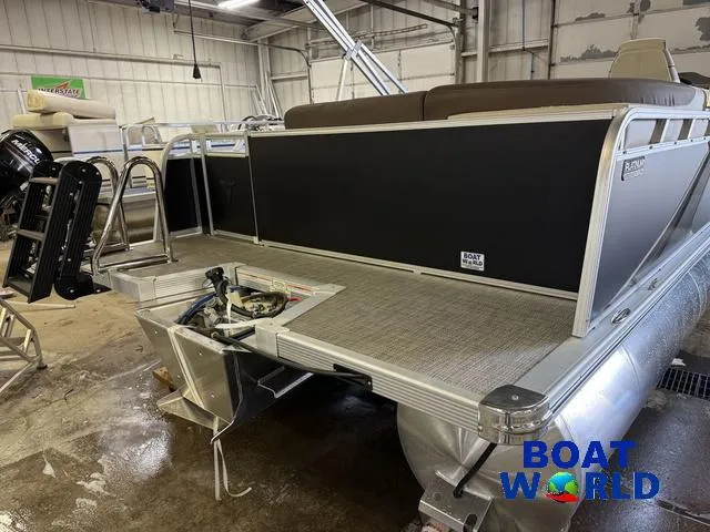 Slide: The Image of 2025 Tahoe LTZ 2385 Elite Cruise pontoon boat in showroom, featuring Honda 4-Stroke EFI engine. - 41