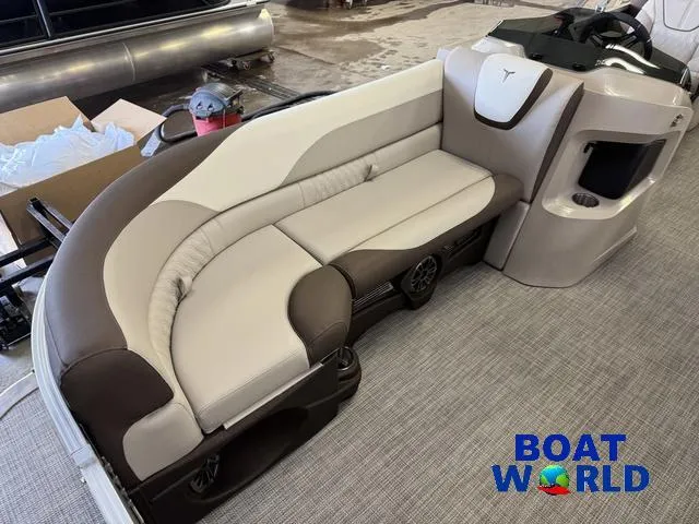 Slide: The Image of 2025 Tahoe LTZ 2385 Elite Cruise boat interior with plush seating and modern design. - 9
