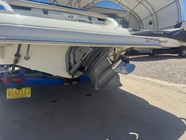 Slide: The Image of 2006 Larson 186 SENZA boat rear view with outboard motor and trailer. - 3