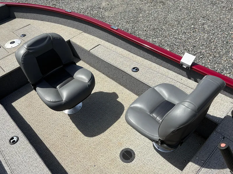 Slide: The Image of 2021 Tracker Super Guide V-16 T boat interior with two gray seats. - 10