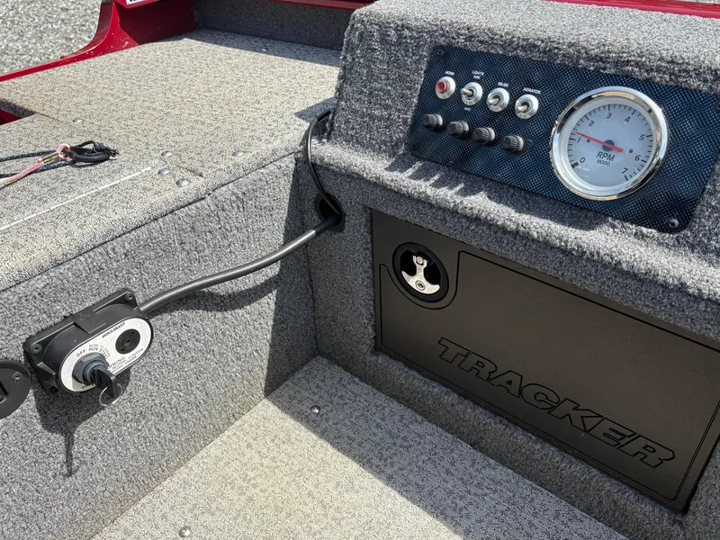 Slide: The Image of 2021 Tracker Super Guide V-16 T boat dashboard with controls and gauge. - 12