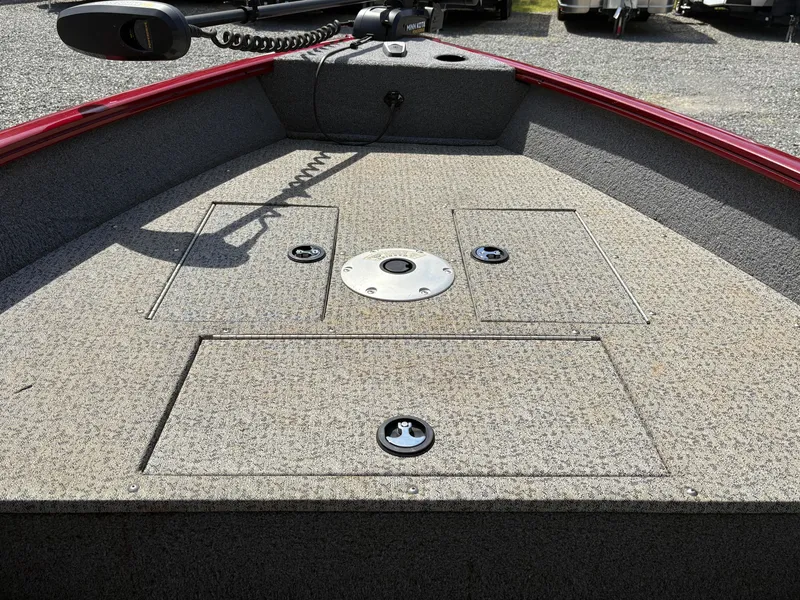 Slide: The Image of 2021 Tracker Super Guide V-16 T boat deck with storage compartments and trolling motor. - 9