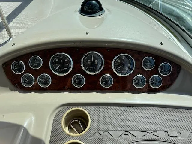 Slide: The Image of Dashboard of 2001 Maxum 3500 SCR boat with gauges and controls. - 11