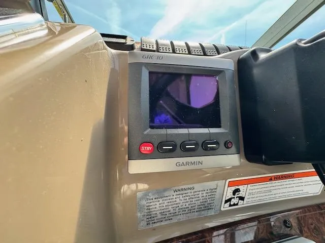 Slide: The Image of Garmin GHC 10 display on 2001 Maxum 3500 SCR boat dashboard. - 13