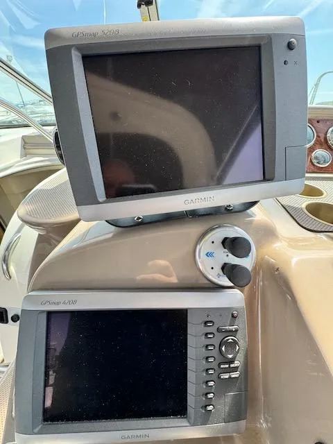 Slide: The Image of Garmin GPS displays on 2001 Maxum 3500 SCR boat dashboard. - 15