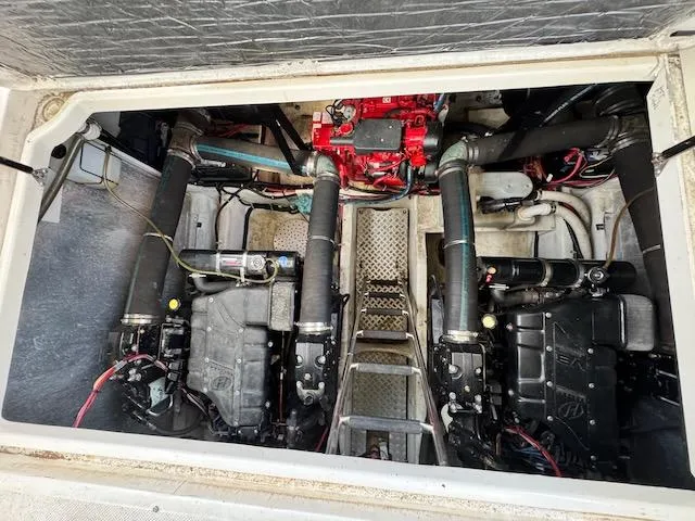 Slide: The Image of Engine compartment of a 2001 Maxum 3500 SCR boat, showcasing dual engines and mechanical components. - 18