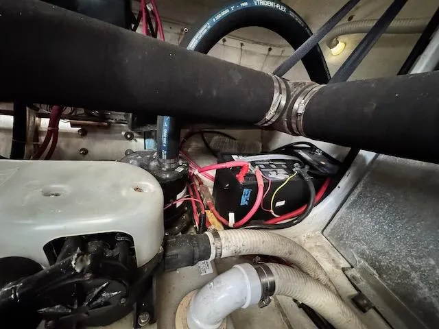 Slide: The Image of Engine compartment of a 2001 Maxum 3500 SCR boat, showing hoses and wiring. - 23