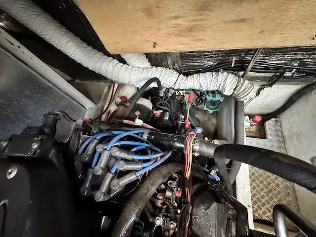 Slide: The Image of Engine compartment of a 2001 Maxum 3500 SCR boat, showing wiring and components. - 24