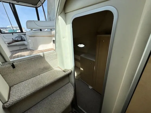 Slide: The Image of Interior view of 2001 Maxum 3500 SCR yacht, featuring stairs and cabin entrance. - 29