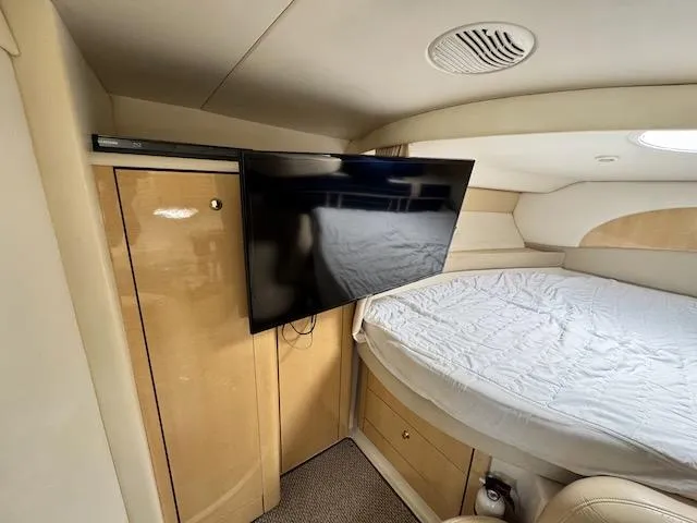 Slide: The Image of Interior of 2001 Maxum 3500 SCR yacht with bed and mounted TV. - 33