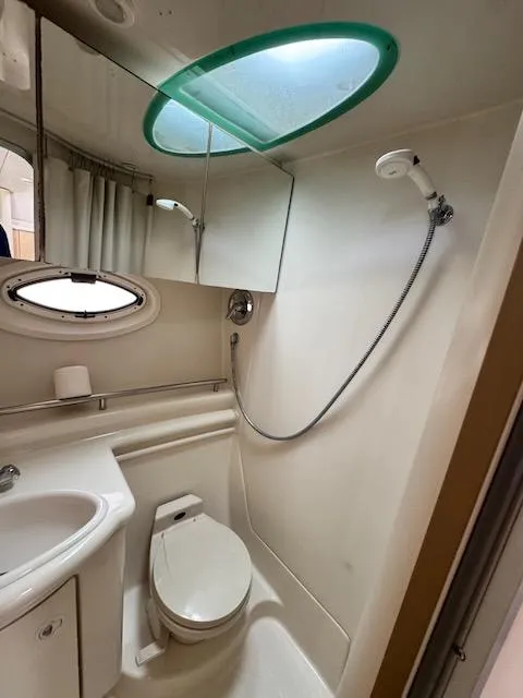 Slide: The Image of Bathroom interior of 2001 Maxum 3500 SCR yacht with shower and toilet. - 35