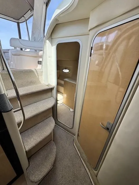 Slide: The Image of Interior view of 2001 Maxum 3500 SCR yacht, featuring carpeted stairs and cabin access. - 37