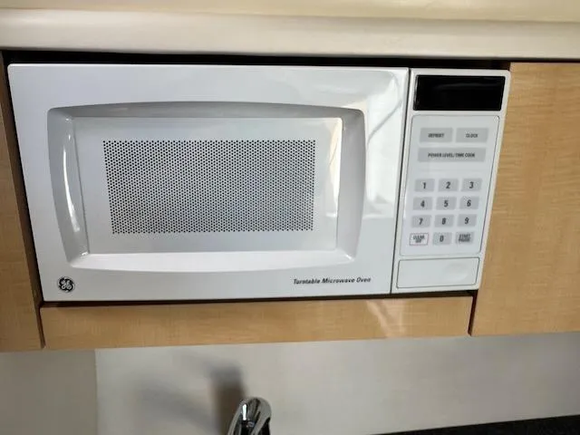 Slide: The Image of Built-in GE microwave in 2001 Maxum 3500 SCR boat kitchen. - 41