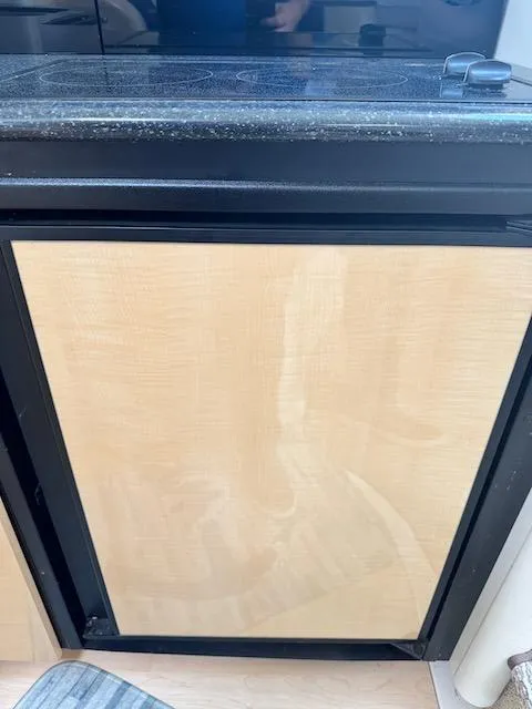 Slide: The Image of Wooden cabinet door in a 2001 Maxum 3500 SCR boat interior. - 42