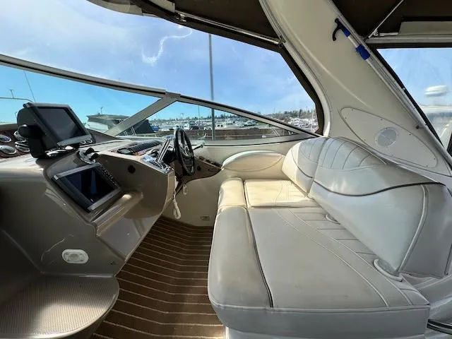 Slide: The Image of Interior of 2001 Maxum 3500 SCR boat with leather seating and navigation equipment. - 9