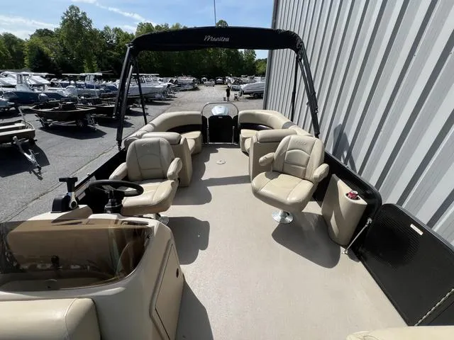 Slide: The Image of 2021 Manitou 23 Aurora LE VP pontoon boat with beige seating and spacious deck. - 5