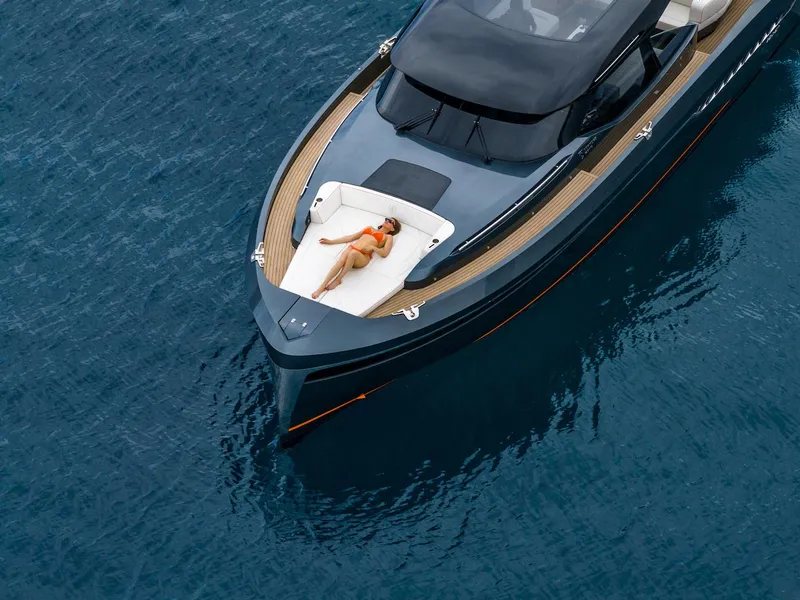 Slide: The Image of 2023 Bekkers Yachts Azur 45HT on water, person sunbathing on deck. - 23