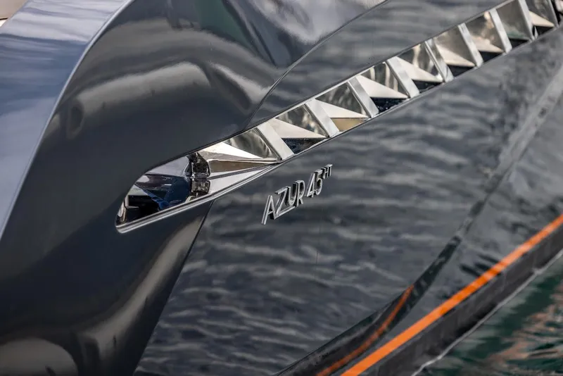 Slide: The Image of 2023 Bekkers Yachts Azur 45HT, sleek design with chrome accents on the water. - 28