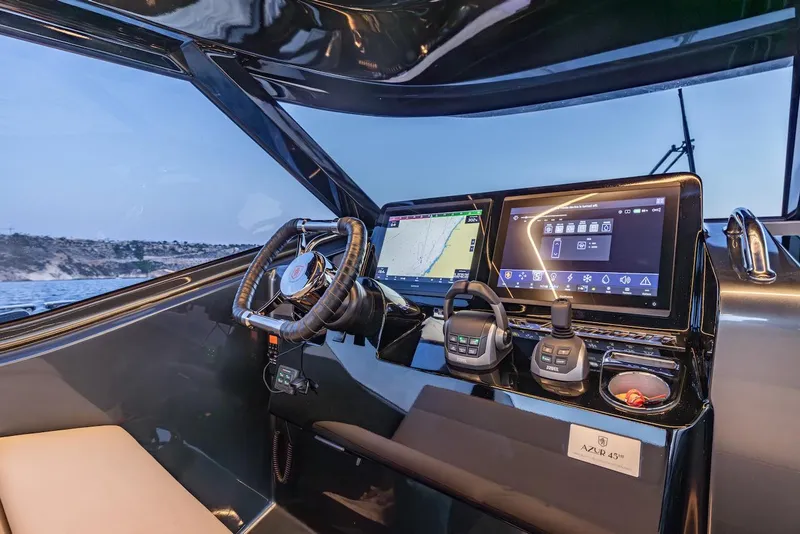 Slide: The Image of Helm of 2023 Bekkers Yachts Azur 45HT with advanced navigation displays and controls. - 44