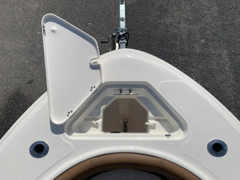 Slide: The Image of 2025 Pioneer ISLANDER 202 boat bow with open storage compartment. - 1