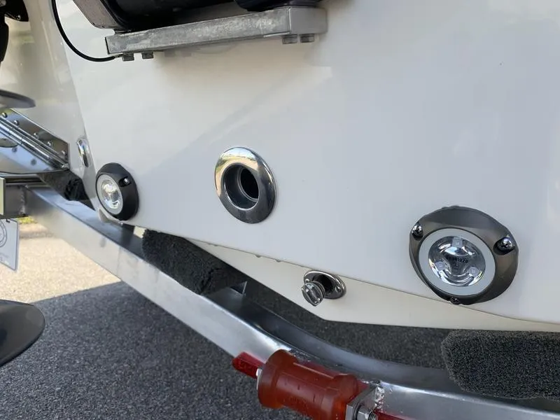 Slide: The Image of Rear view of 2025 Pioneer ISLANDER 202 boat, showcasing underwater lights and fittings. - 11