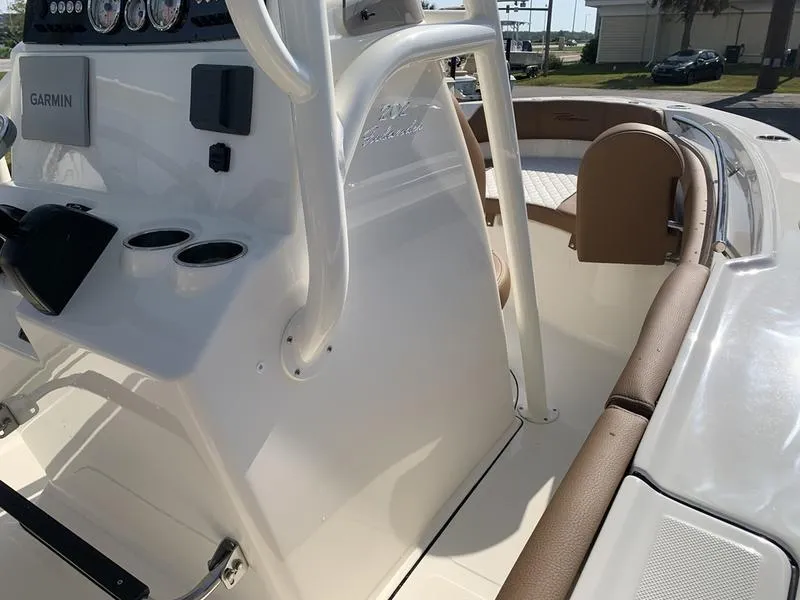 Slide: The Image of Pioneer ISLANDER 2025 boat interior with Garmin dashboard and seating. - 24