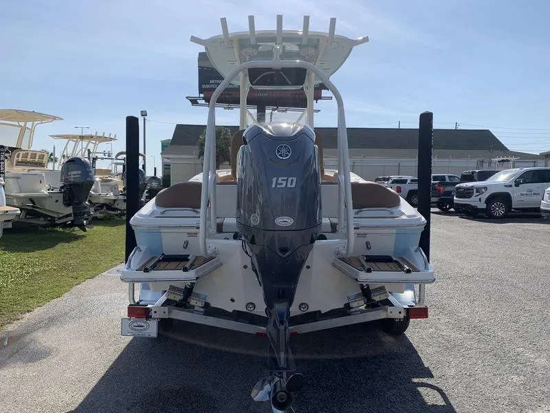 Slide: The Image of 2025 Pioneer ISLANDER 202 boat with Yamaha 150 engine, parked outdoors. - 3
