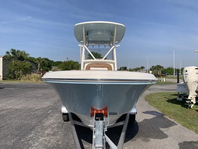 Slide: The Image of 2025 Pioneer ISLANDER 202 boat on trailer, front view, outdoors. - 6