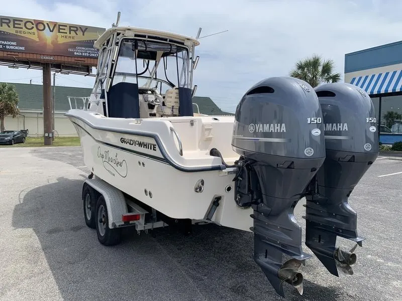 Slide: The Image of 2006 Grady-White 258 Journey boat with twin Yamaha 150 engines on a trailer. - 1
