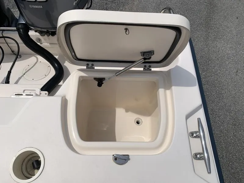 Slide: The Image of Open storage compartment on a 2006 Grady-White 258 Journey boat. - 10