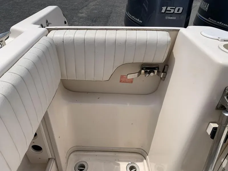 Slide: The Image of 2006 Grady-White 258 Journey boat interior with Yamaha 150 engine visible. - 11