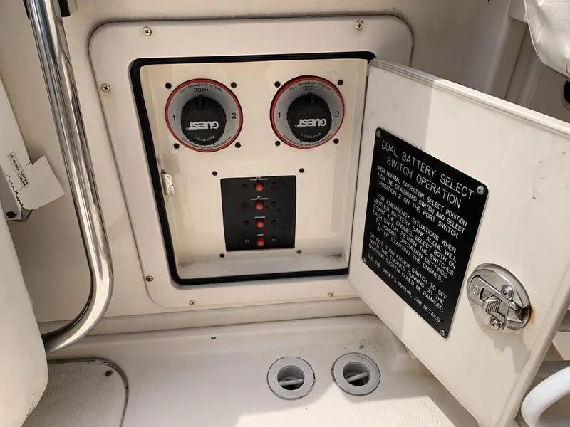 Slide: The Image of Control panel of a 2006 Grady-White 258 Journey boat with dual battery switches. - 13
