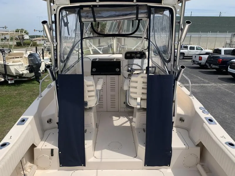 Slide: The Image of 2006 Grady-White 258 Journey boat interior with seating and control panel. - 15