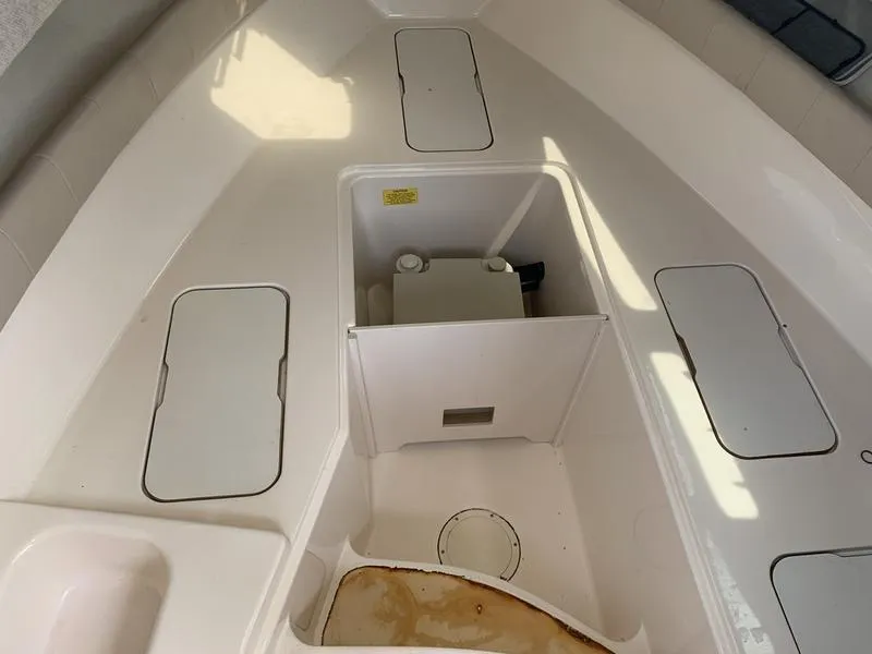 Slide: The Image of 2006 Grady-White 258 Journey boat interior with storage compartments. - 26