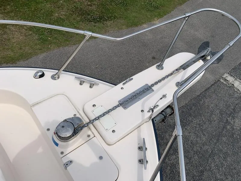 Slide: The Image of Bow of 2006 Grady-White 258 Journey boat with anchor chain and railing. - 28