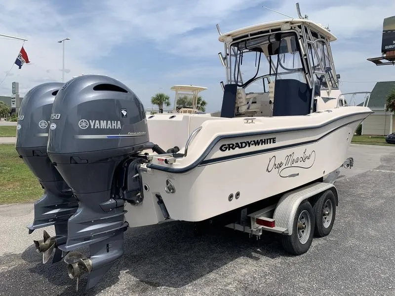 Slide: The Image of 2006 Grady-White 258 Journey boat with twin Yamaha engines on a trailer. - 3
