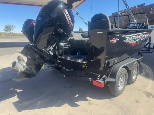 Slide: The Image of 2024 Tracker Targa V18 boat with Mercury outboard motor on a trailer. - 3