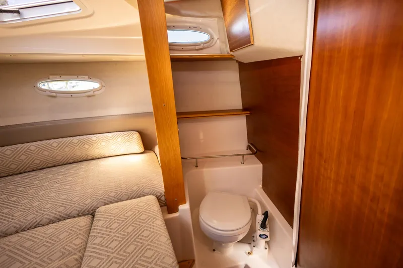 Slide: The Image of 2019 Cutwater C-24 Coupe interior with cozy cabin and compact bathroom. - 10