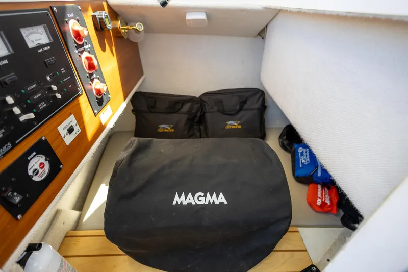Slide: The Image of Interior of 2019 Cutwater C-24 Coupe with Magma grill cover and storage compartments. - 13